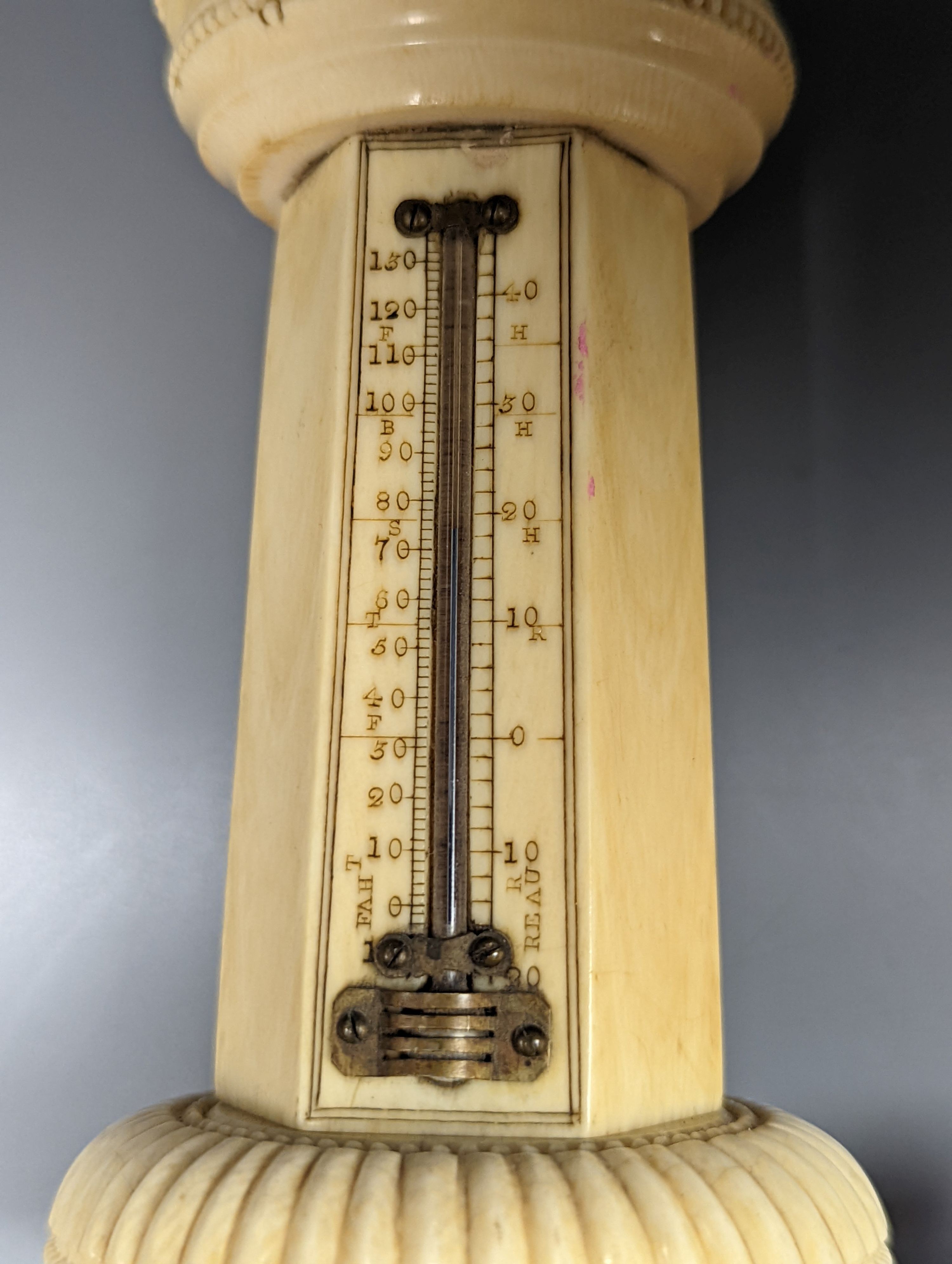 A 19th century ivory table thermometer, 13cm.